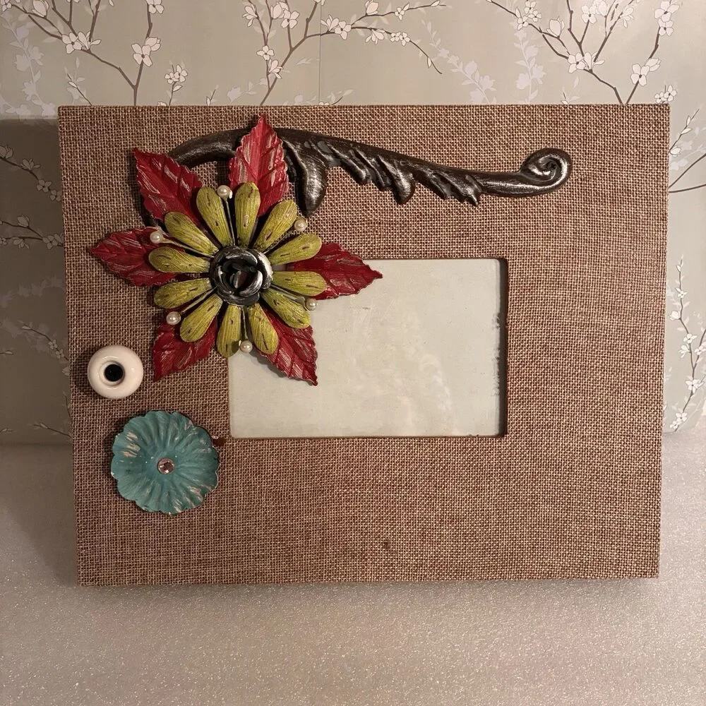 Picture Frame Wrapped In Burlap And Adorned W/ Metal Flowers & Knob. 4”x6” Pic.